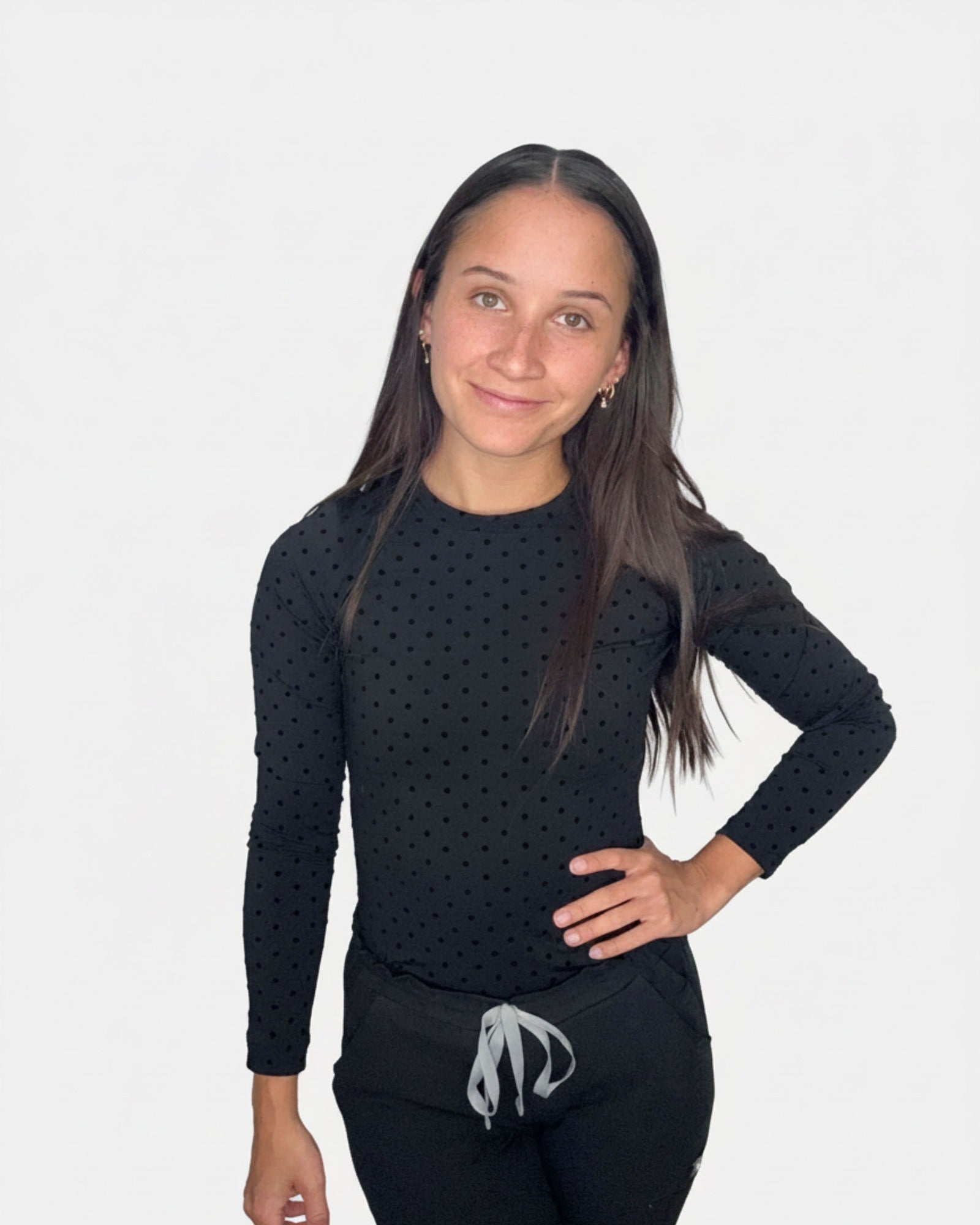 Black PolkaDot CoreSupport underscrub on model, three-quarter angle