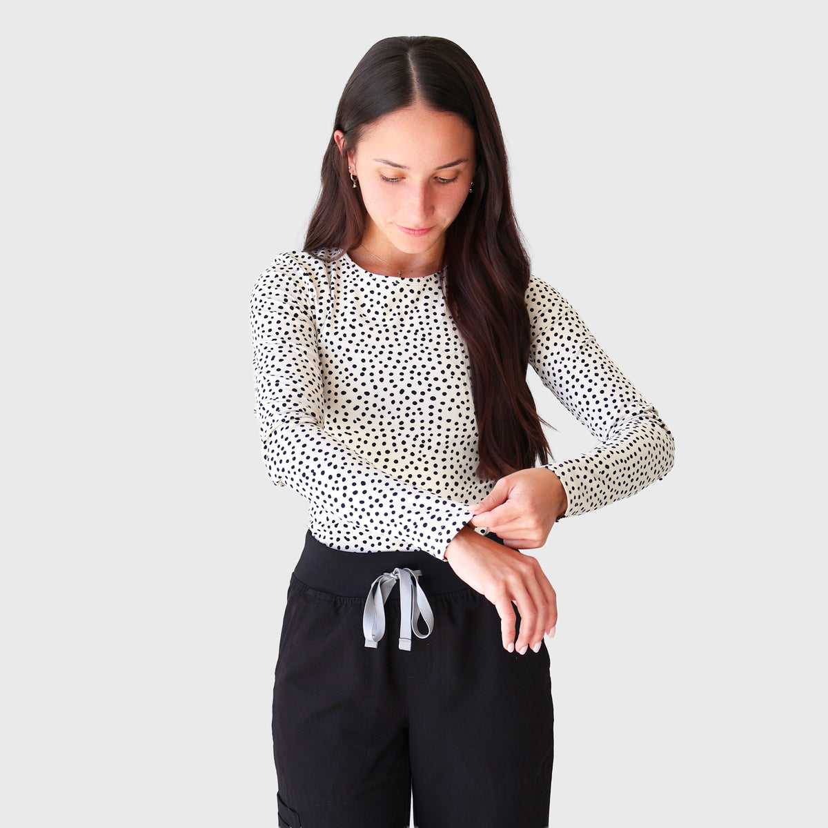 FlexForm Compression Underscrub — Beige Leopard, adjusting the long-sleeve cuff