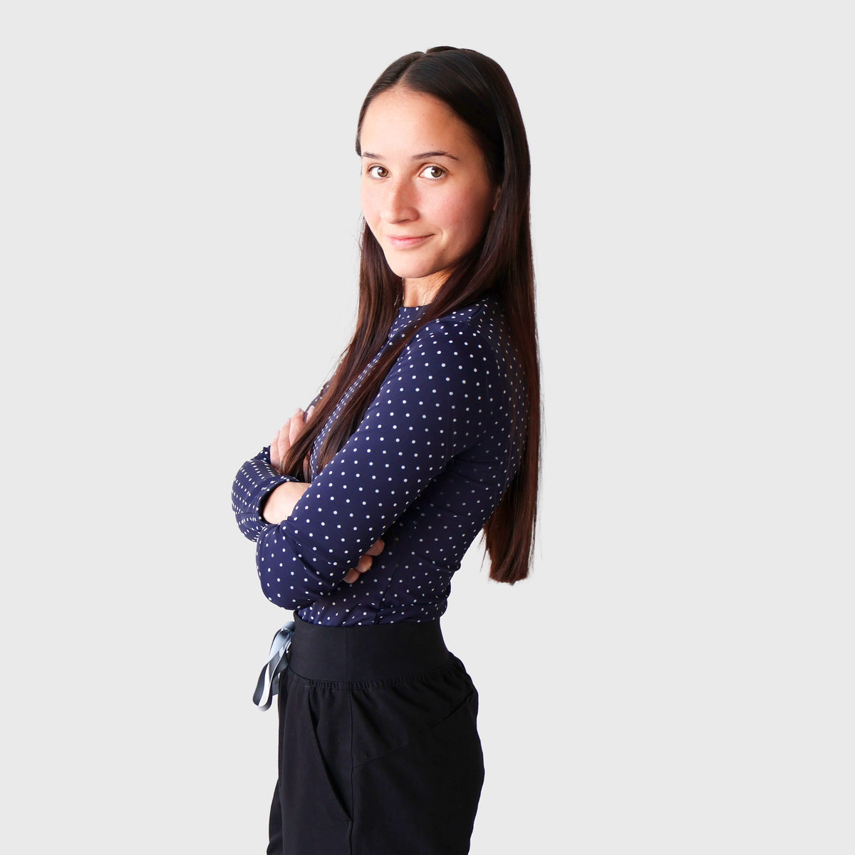 Navy & White PolkaDot CoreSupport Underscrub, side view: long-sleeve navy top with small white polka dots